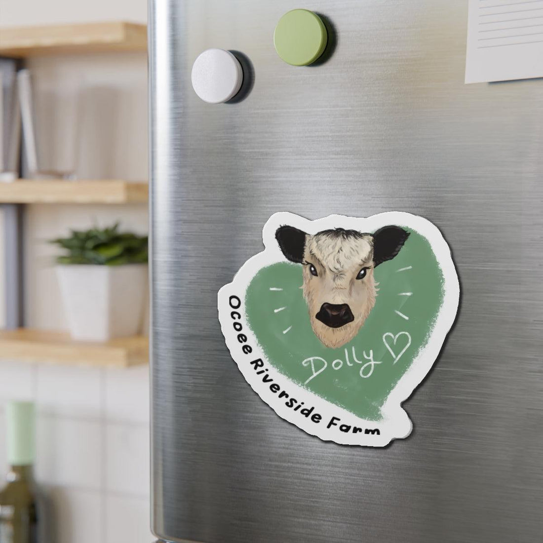 Cute Cow Die-Cut Magnet with cow face and green heart design on a refrigerator door