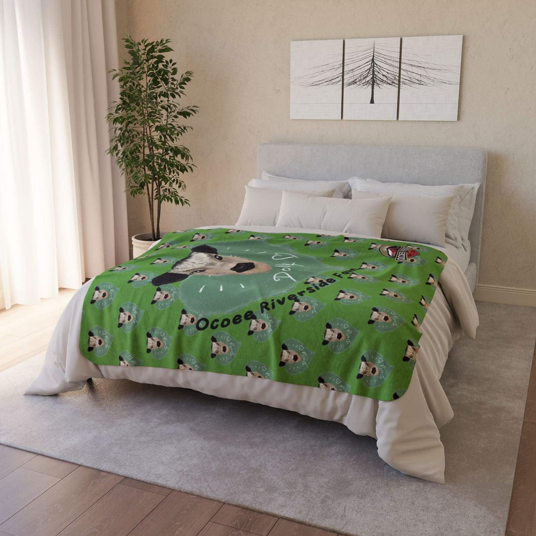 Cozy Spud the Cow Blanket with green cow print draped on bed in modern bedroom