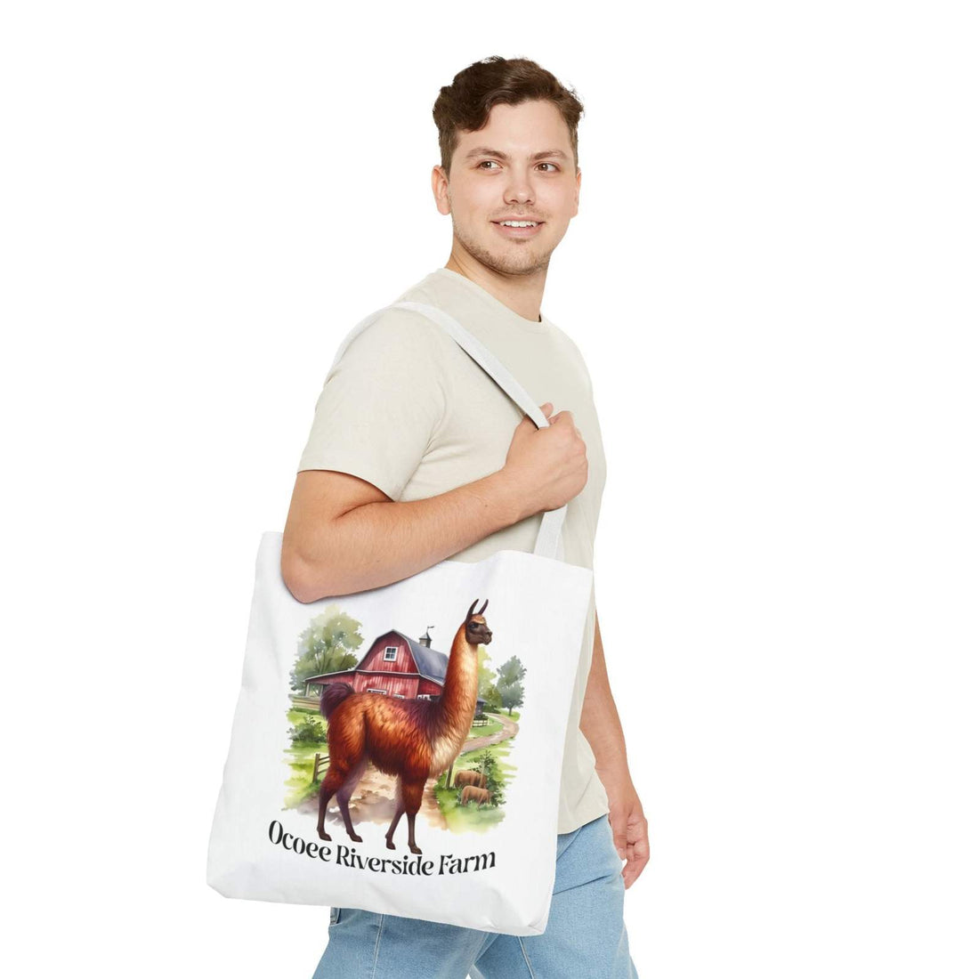 Man carrying white Alpaca Tote Bag with Ocoee Riverside Farm alpaca farm design and reinforced handles