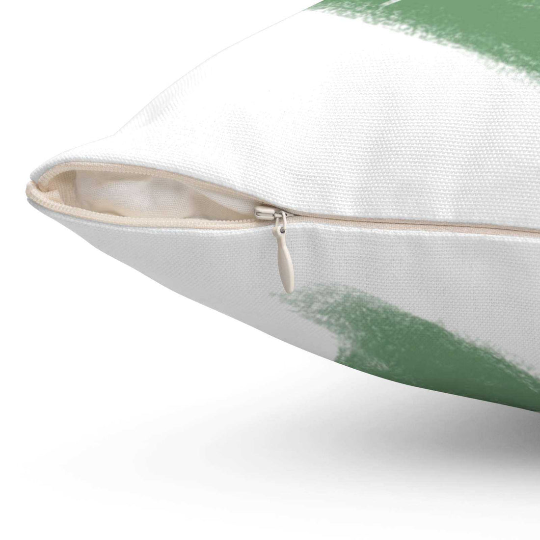 Close-up of spun polyester heart pillow with beige zipper and green-white design detail