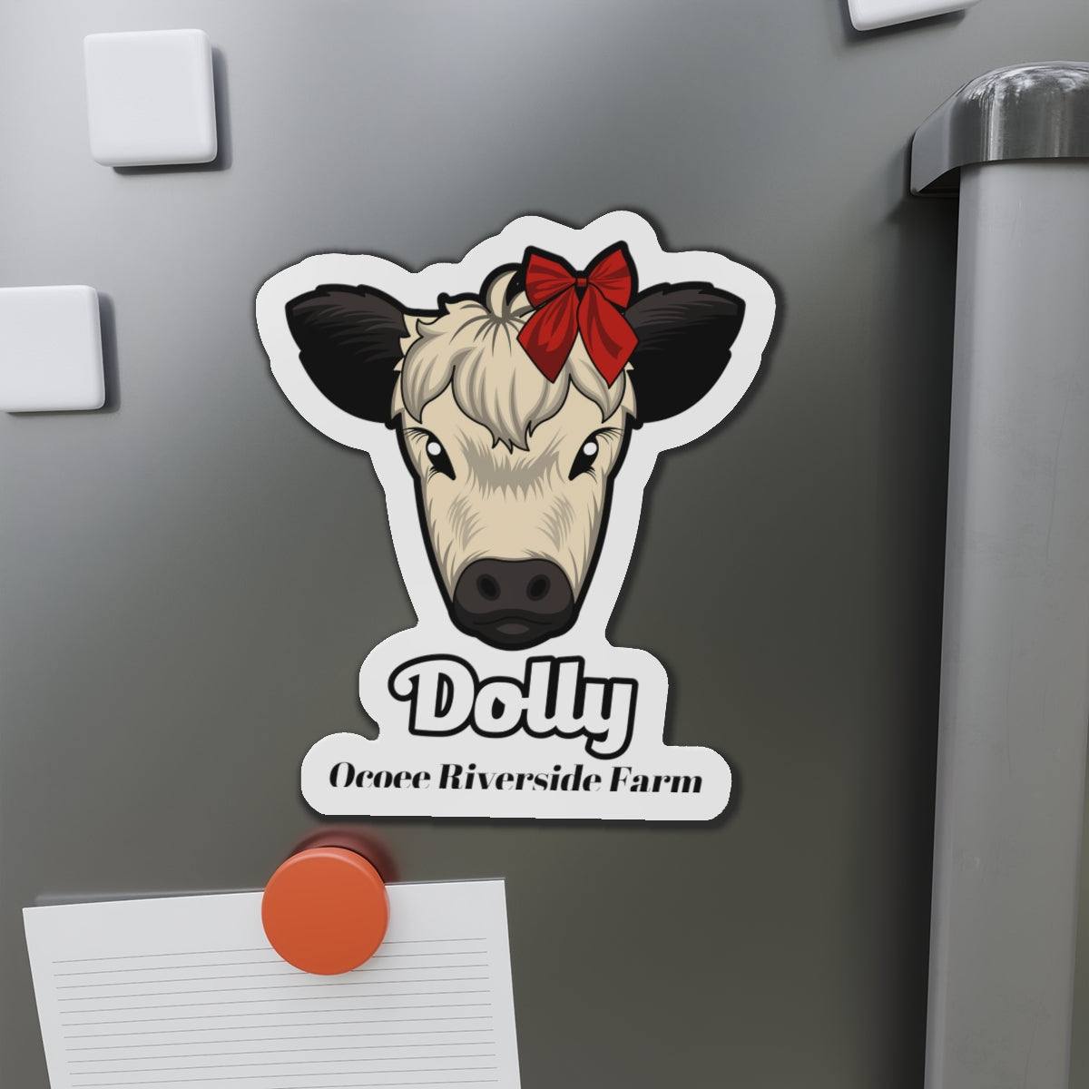 Charming Cow Die-Cut Magnet with a cute cow face and red bow on a gray refrigerator door, farmhouse decor accessory
