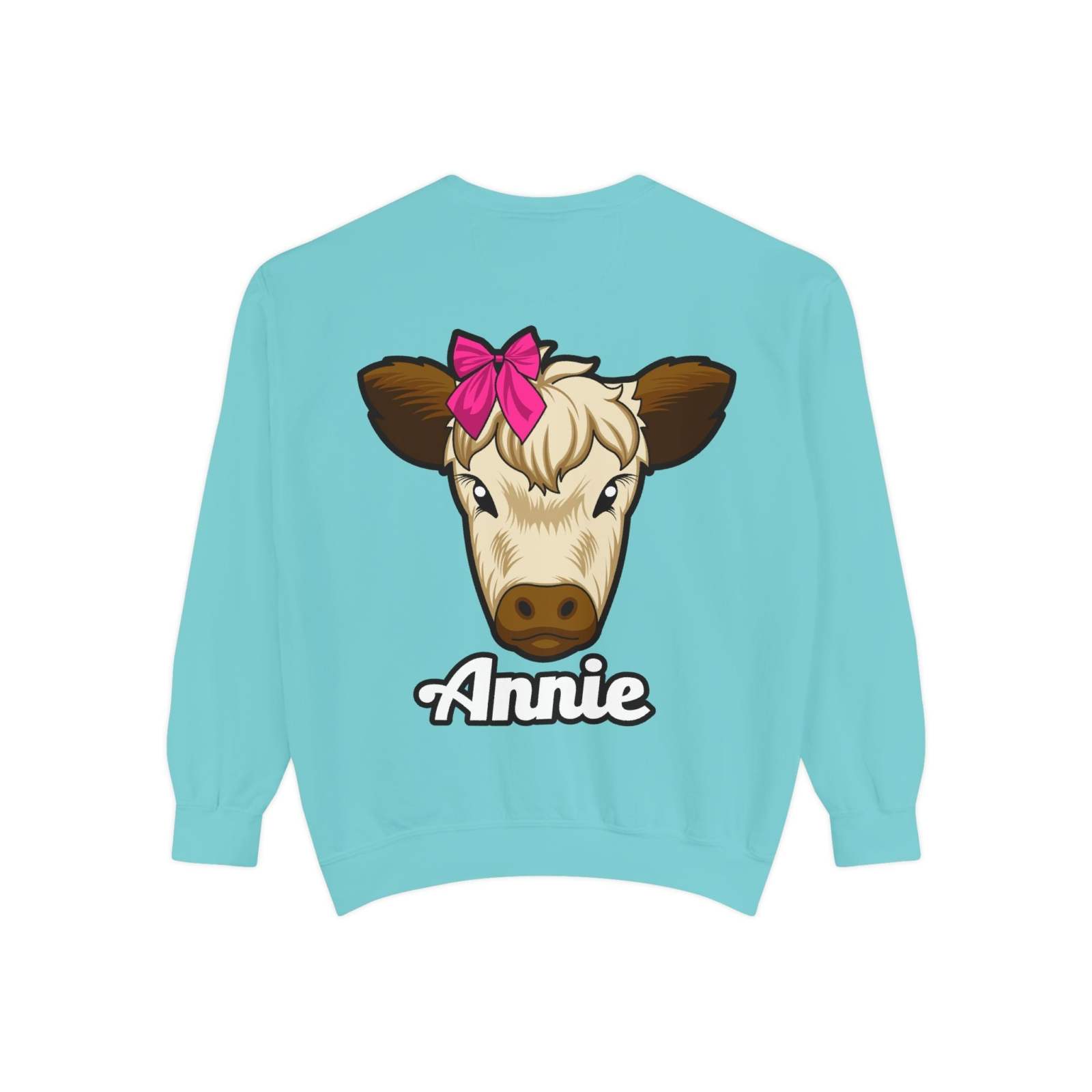 Cute farm animal sweatshirt featuring Annie the Cow with a red bow on turquoise background.