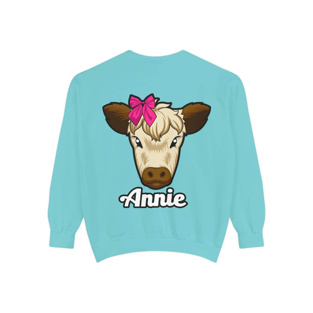 Cute farm animal sweatshirt featuring Annie the Cow with a red bow on turquoise background.