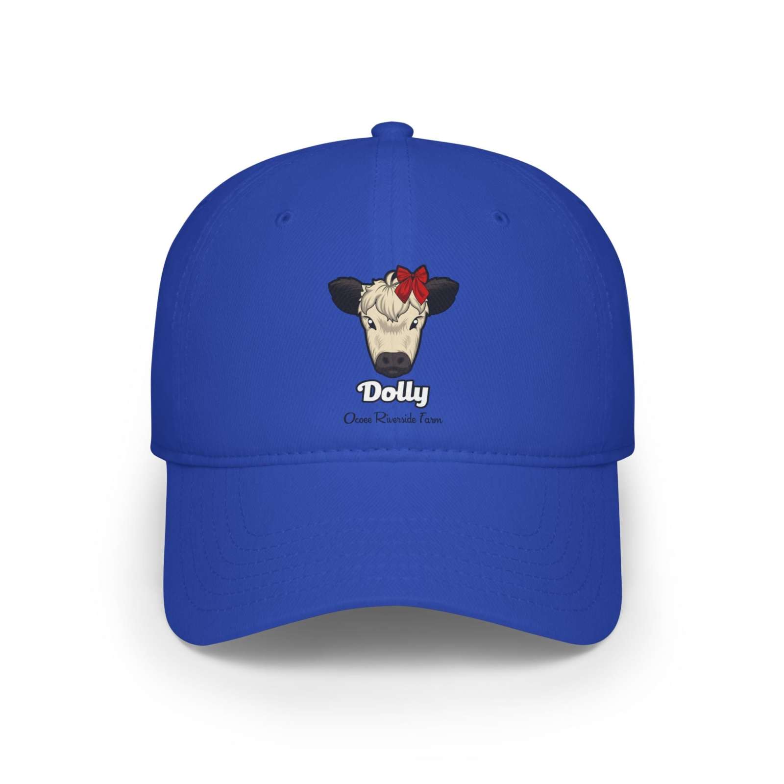Blue cow baseball cap featuring a cow named Dolly with a red bow on its head.