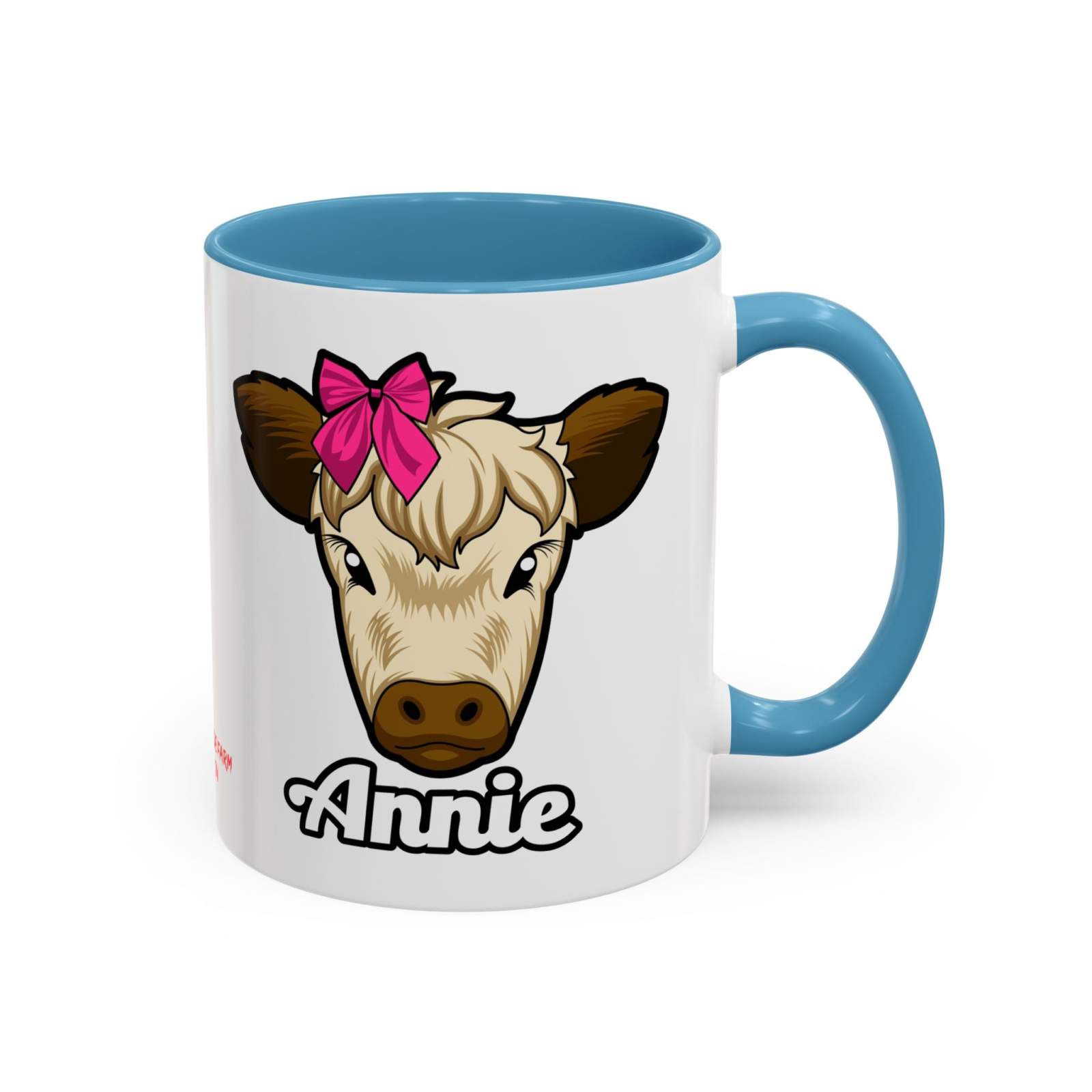 Farmhouse cow coffee mug with a colorful cow and red bow design, blue handle.