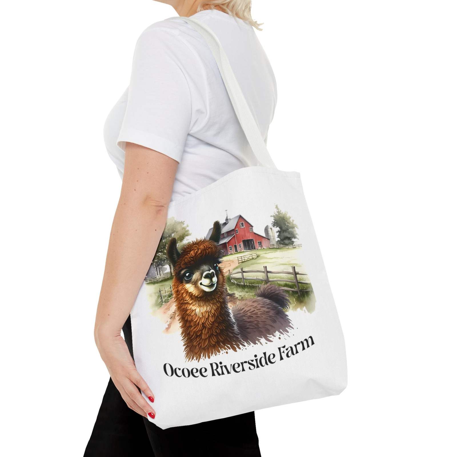 Woman carrying a Llama at Ocoee Riverside Farm Tote Bag featuring a llama and farmhouse design