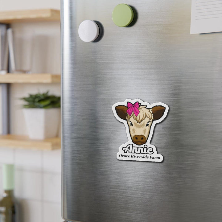 Cow die-cut magnet with cute cow face and pink bow on stainless steel fridge, farmhouse decor accessory
