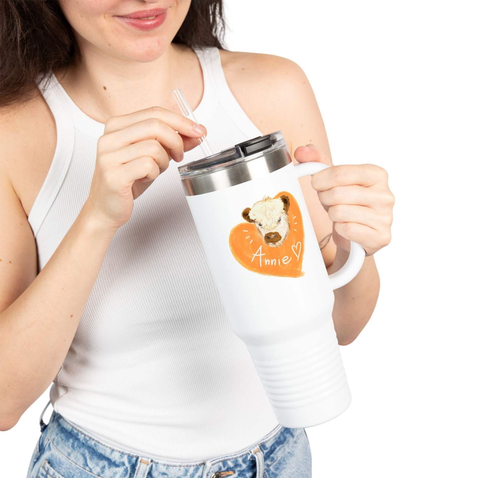 Woman holding personalized insulated travel mug with custom bear and heart design and name "Annie"