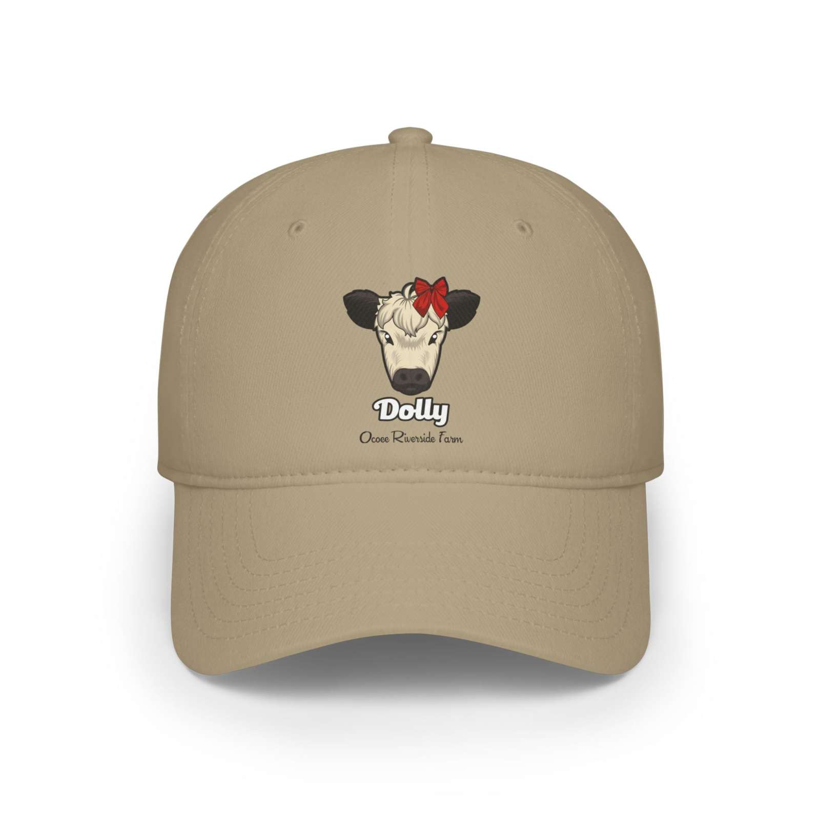 Beige cow baseball cap featuring Dolly the cow with a red bow and Ocoee Riverside Farm text