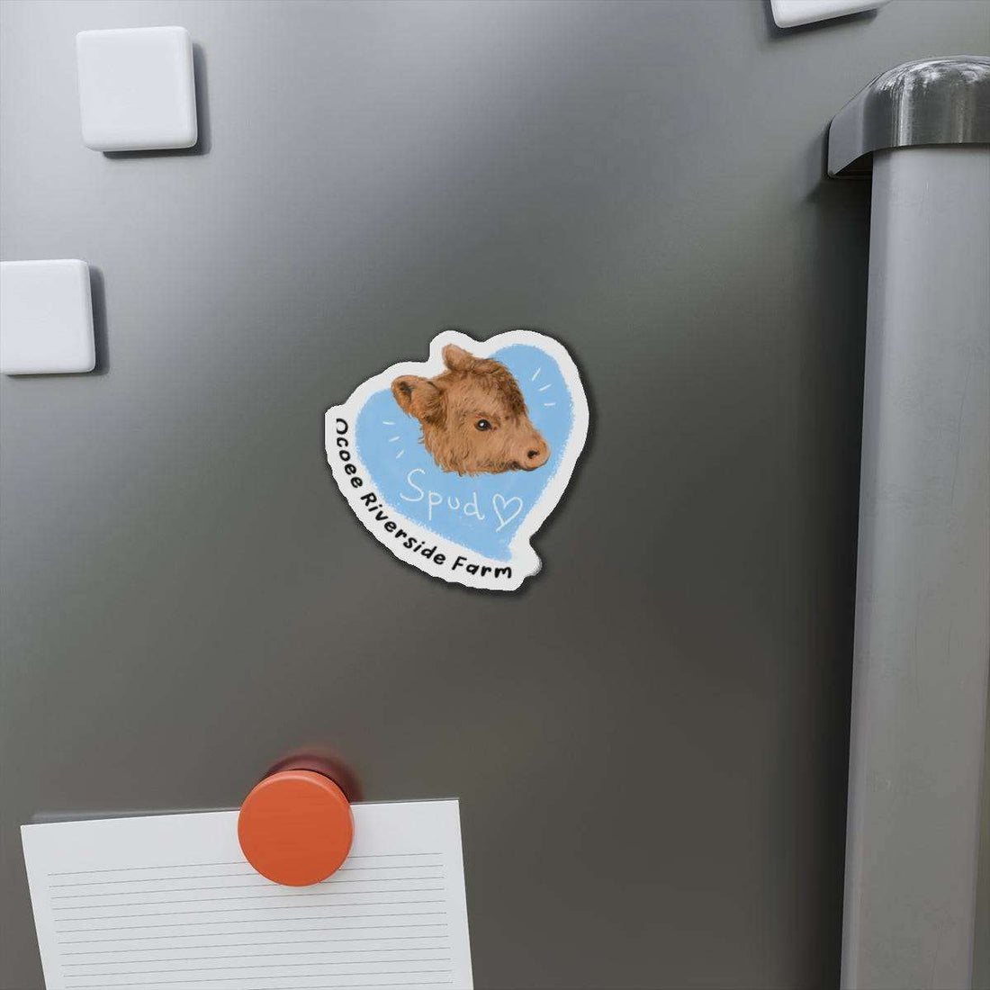 Farm Animal Decor Magnet featuring a charming cow head illustration on a blue background, attached to a gray metal surface.