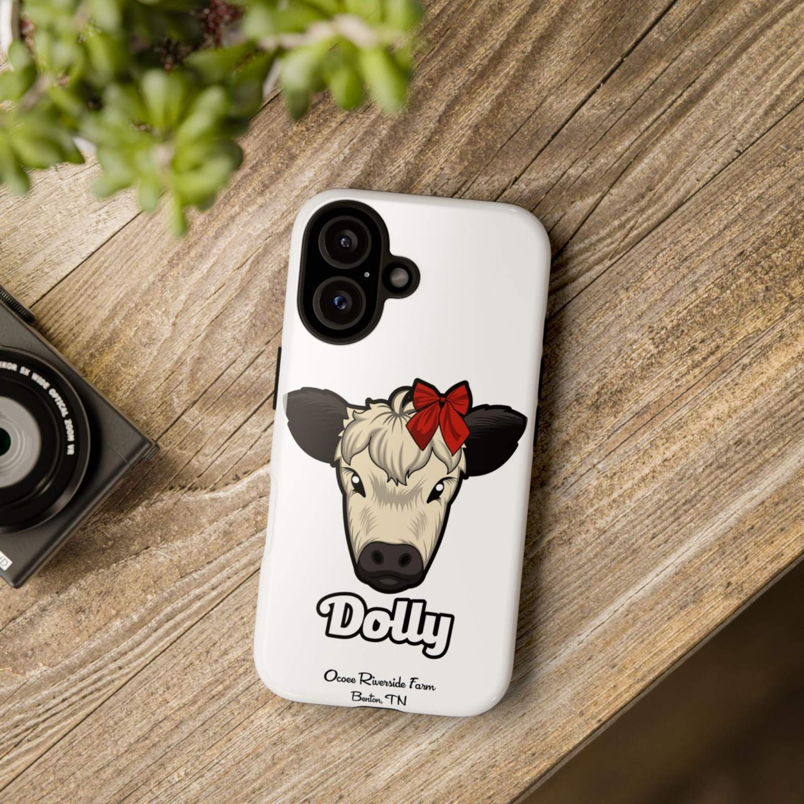 Farmhouse Chic Phone Case featuring Dolly the cow with a red bow, offering rustic charm and modern protection.