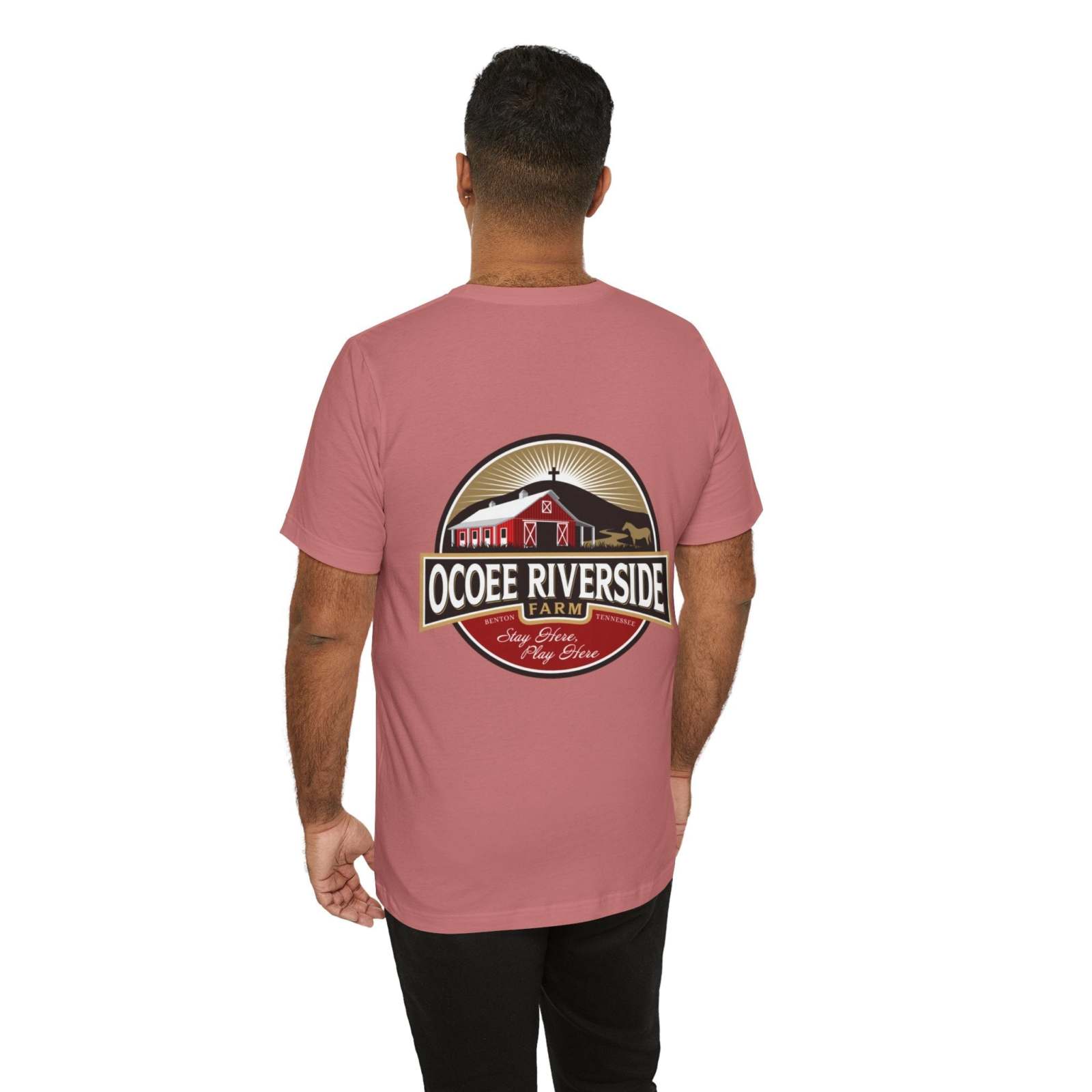 Man wearing a pink unisex sloth t-shirt with Ocoee Riverside Farm logo on the back