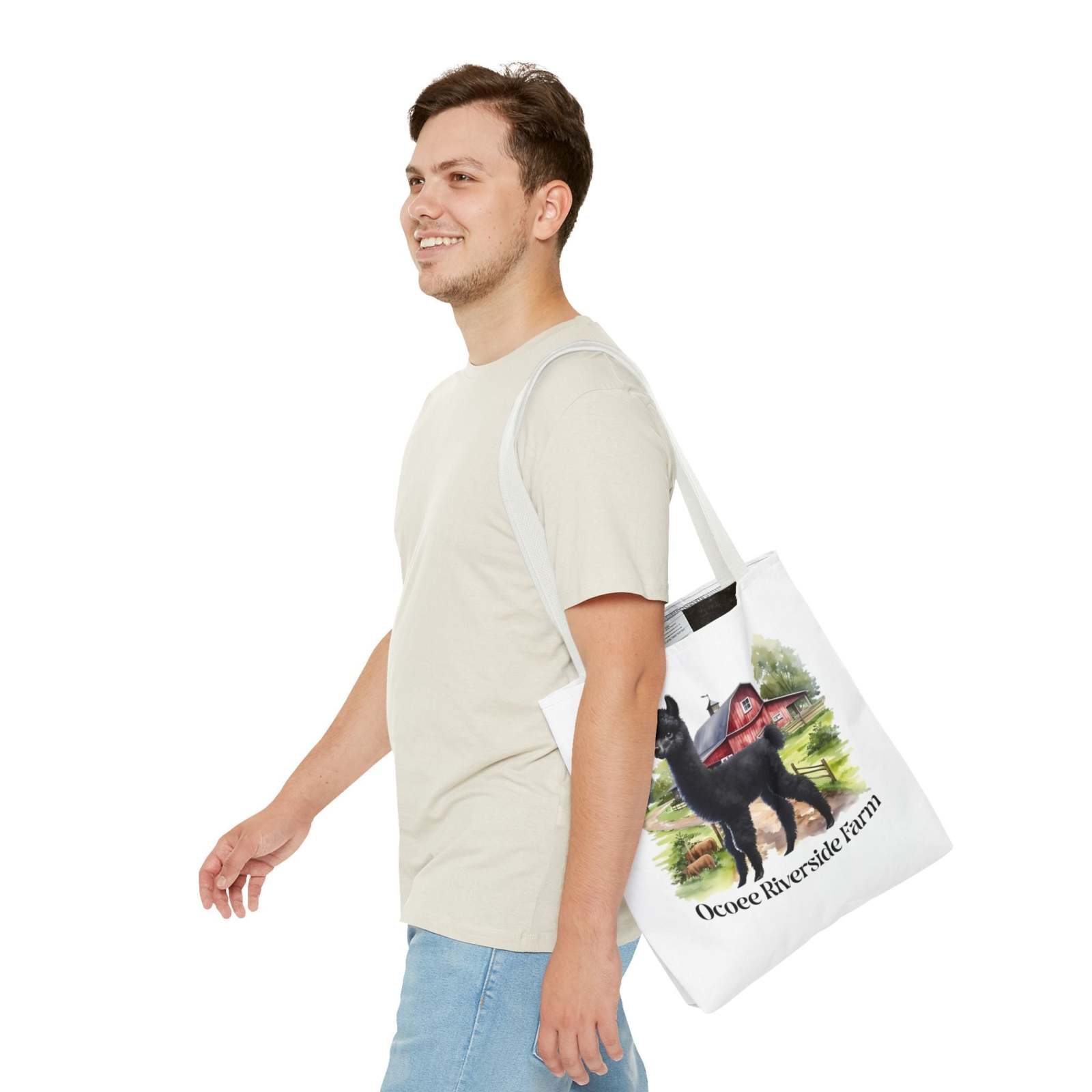 Man carrying eco-friendly Llama Tote Bag from Ocoee Riverside Farm with llama and barn design