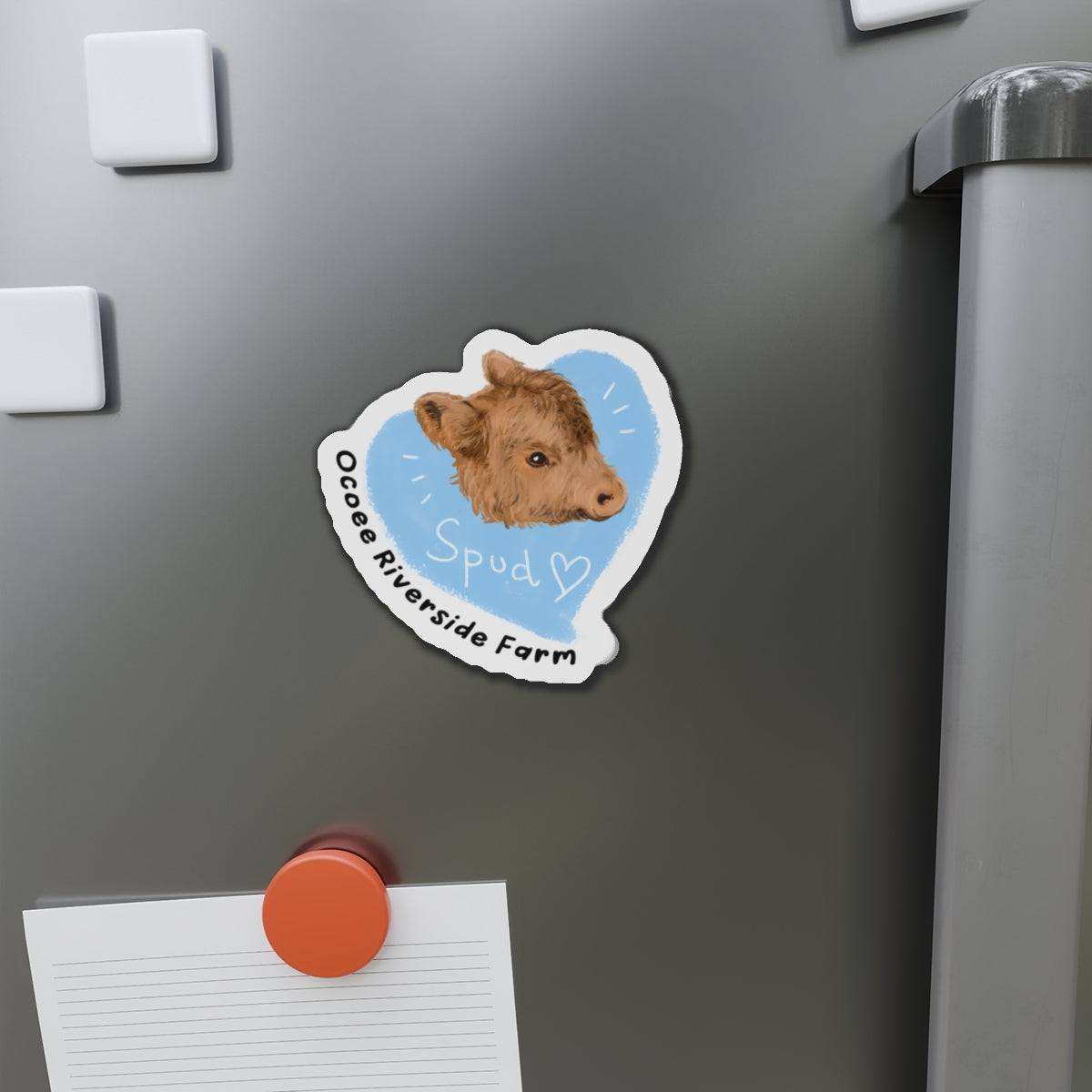 Farm Animal Decor Magnet featuring a charming cow head with "Spud" text on a blue background, attached to a gray metal surface.
