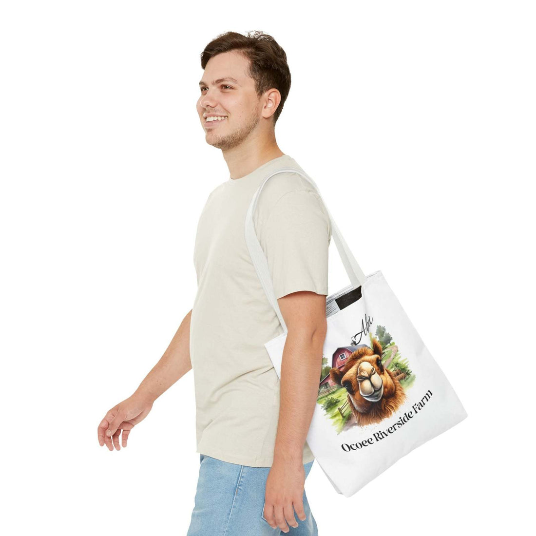 Man carrying Abu Camel Tote Bag Ocoee Riverside Farm eco-friendly shopping bag with camel design and farm scenery