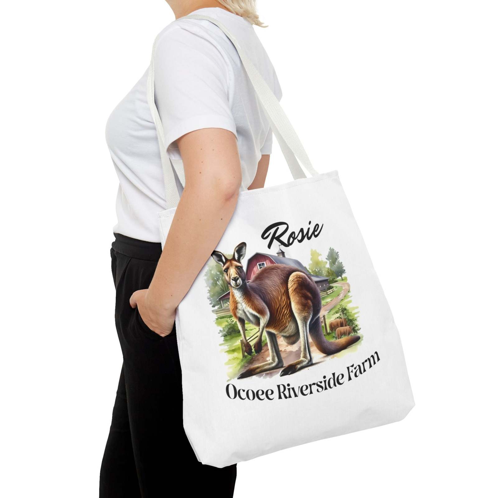 White eco-friendly Rosie Kangaroo Tote Bag from Ocoee Riverside Farm with colorful kangaroo and farm design, worn over shoulder