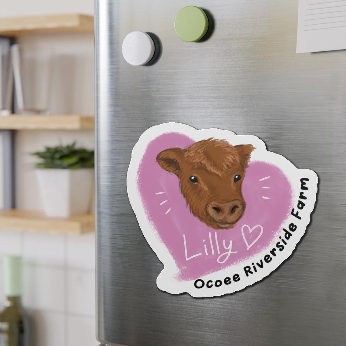 Farm Animal Die-Cut Magnet with adorable cow design and pink heart on stainless steel refrigerator.