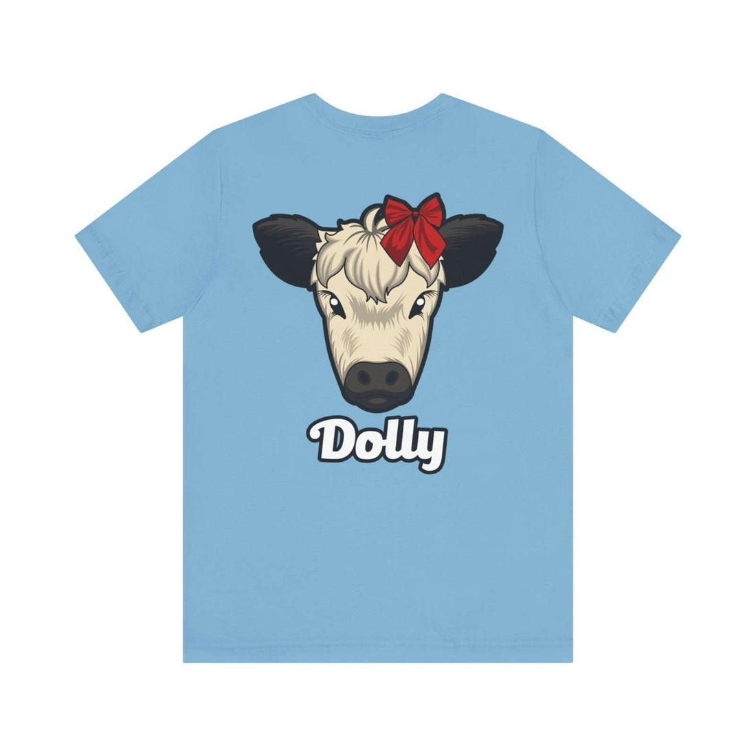 Light blue Country Cow Graphic Tee featuring a cow named Dolly with a red bow on its head.