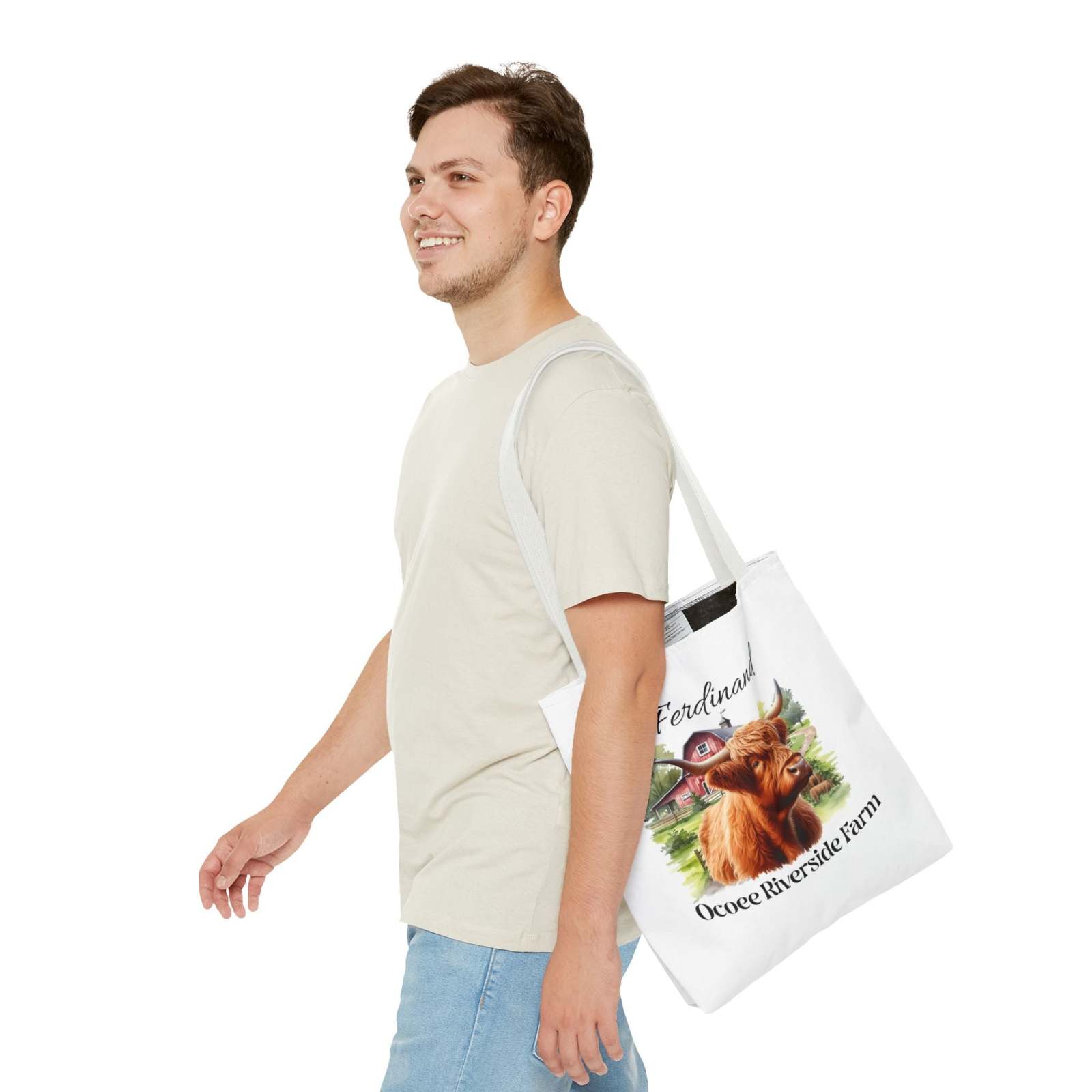 Man wearing Ferdinand Scottish Highland Tote Bag with Highland cow print from Ocoee Riverside Farm eco-friendly shopping bag