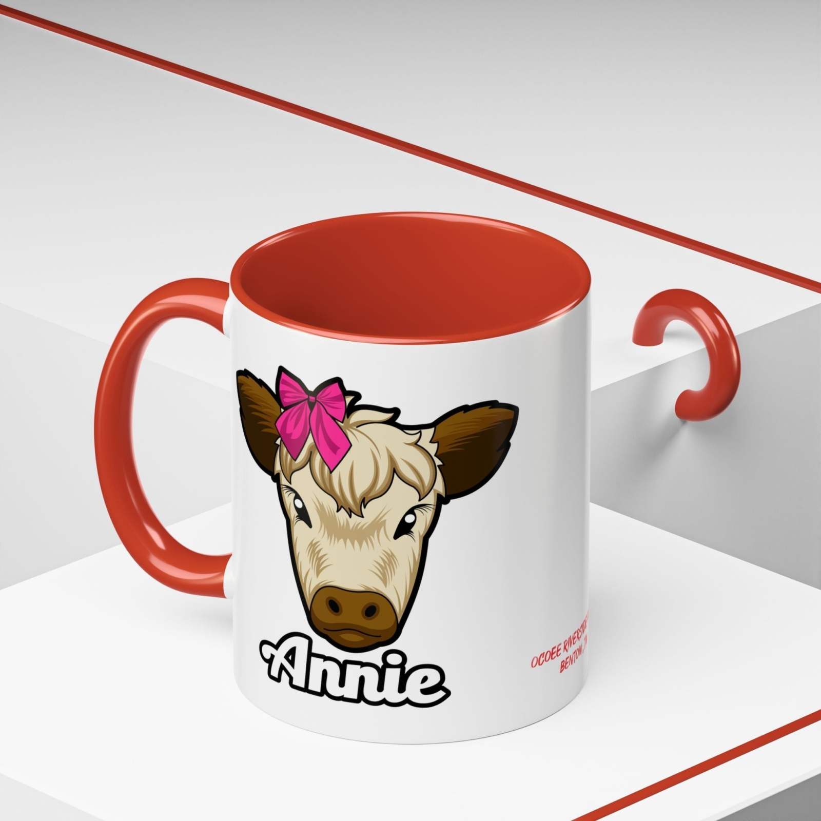 Farmhouse cow coffee mug featuring Annie with a red bow, rustic design, ceramic, perfect for coffee lovers.