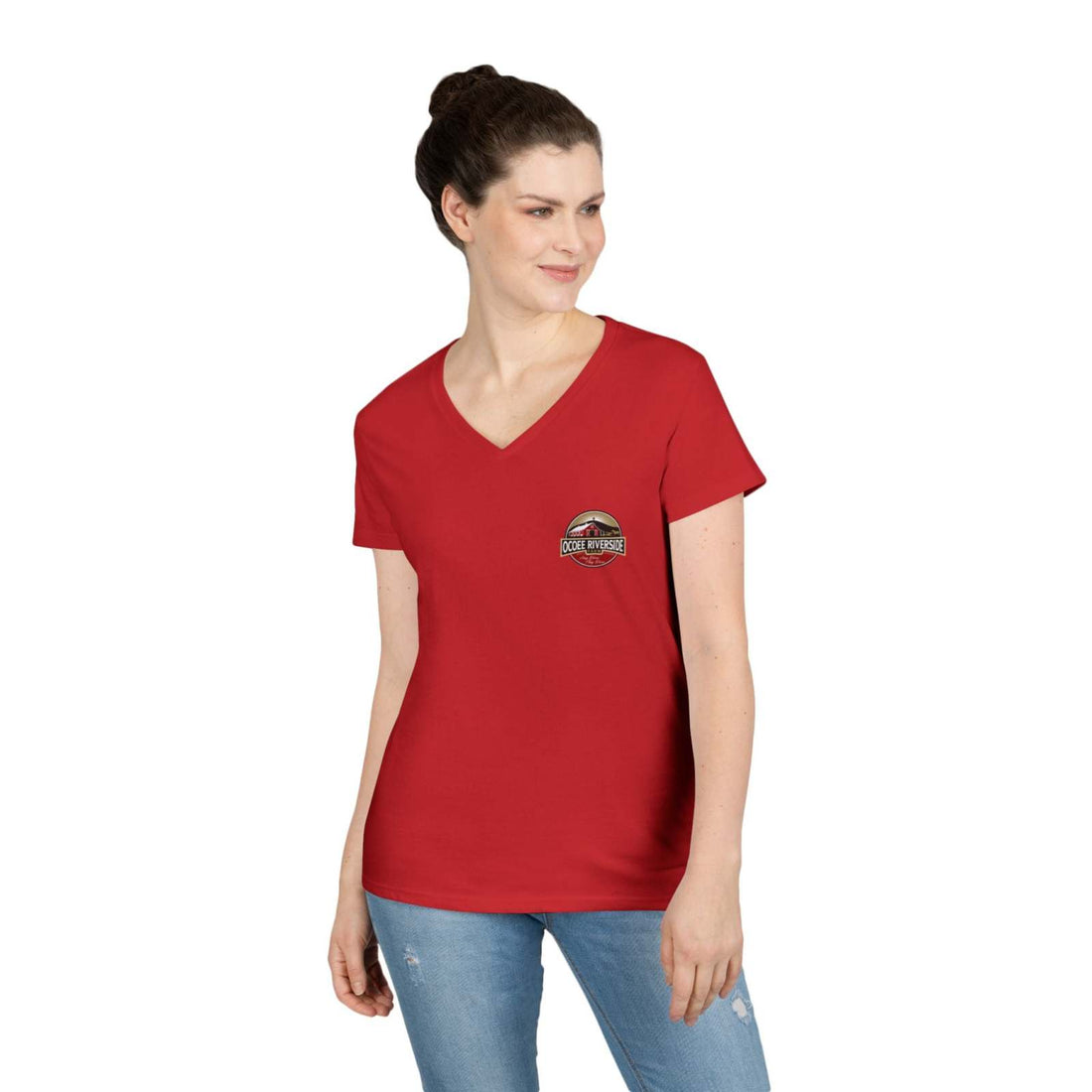 Woman wearing red Spud Heart Women’s V-Neck T-Shirt with Ocoee Riverside Farm logo, paired with blue jeans