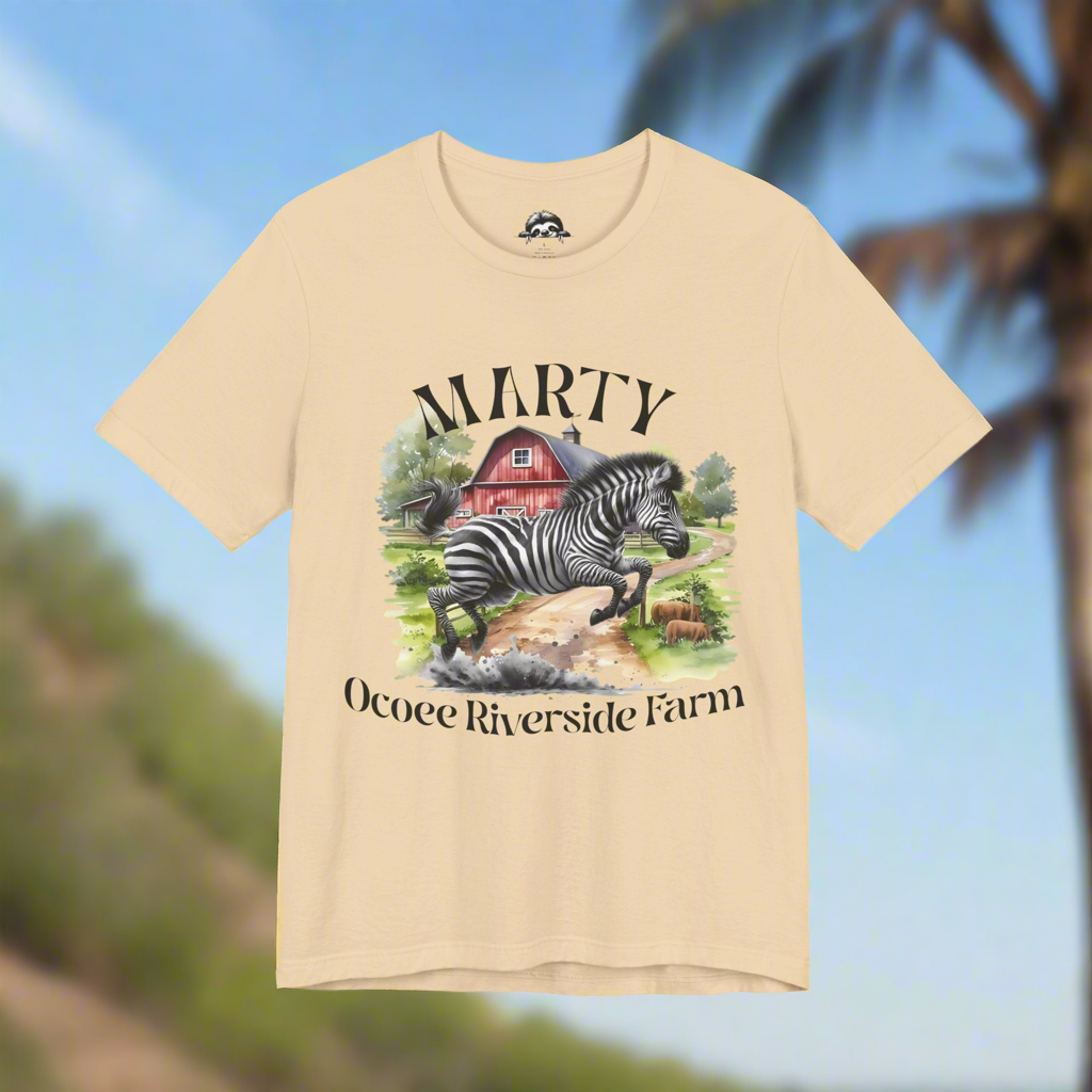 Marty the Zebra T-Shirt featuring a zebra and Ocoee Riverside Farm design on a beige breathable cotton tee
